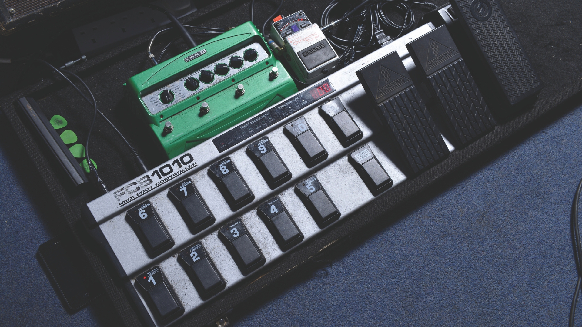 A Behringer MIDI foot controller on a pedalboard