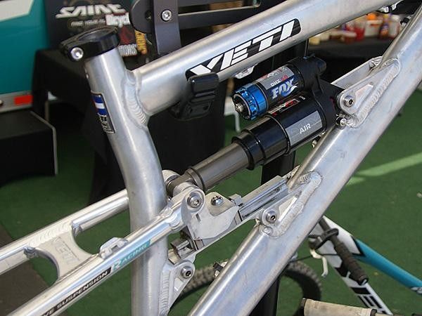 The Fox Racing Shox DHX Air rear shock is controlled by the linear motion rail.