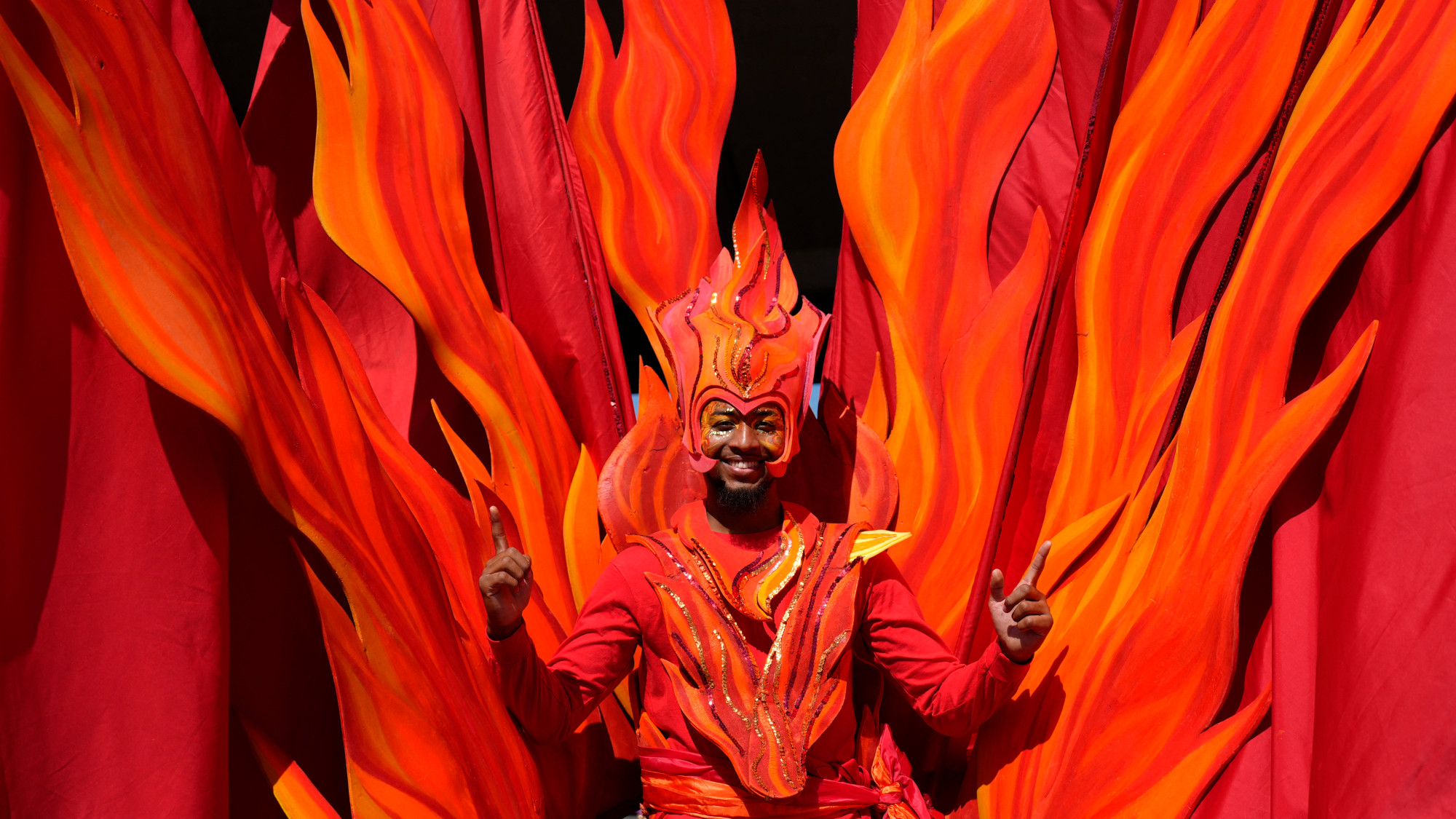 A man wears a costume during a parade