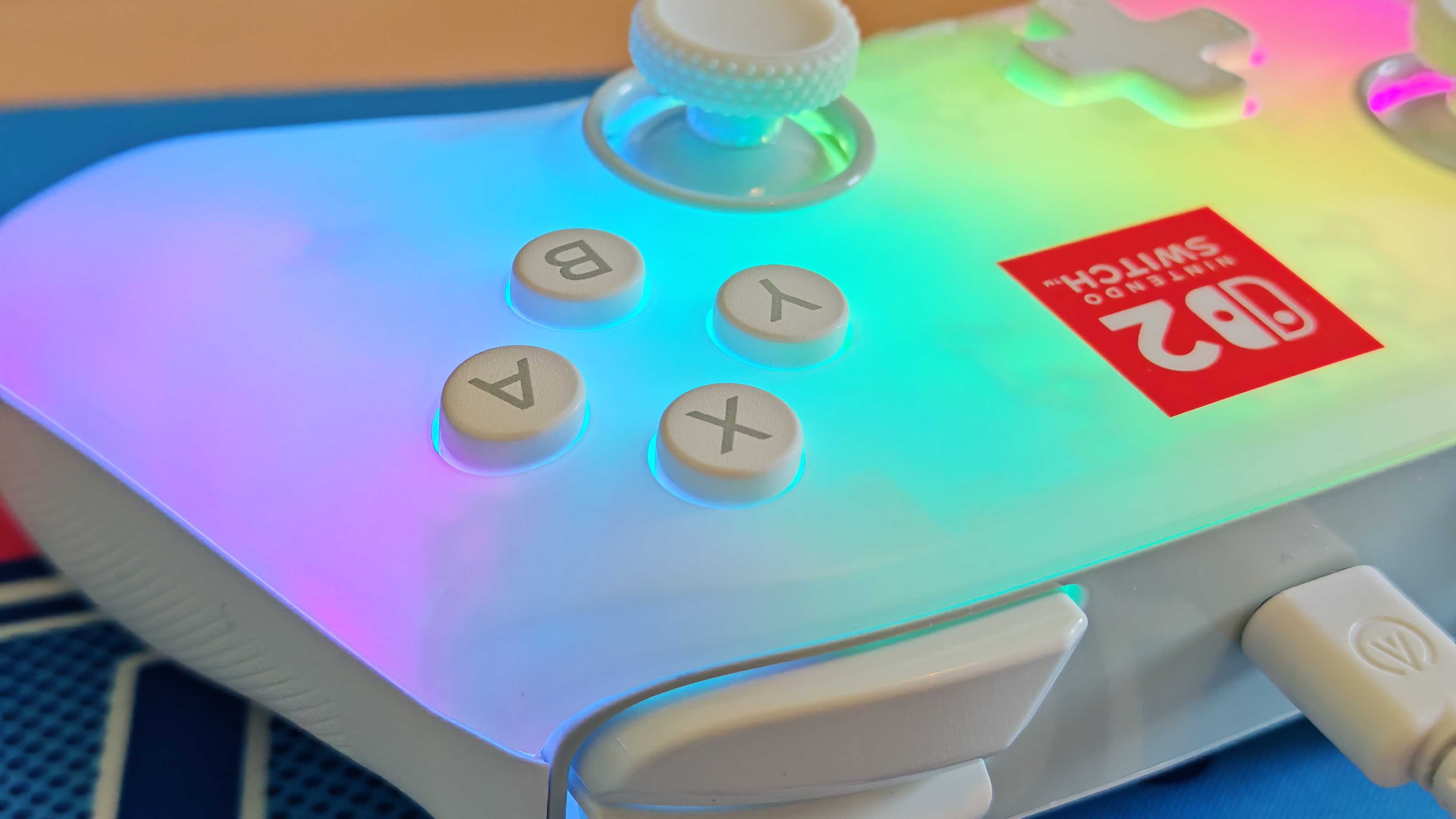 The PowerA Advantage Switch 2 Wired Controller on a bright blue mouse mat.