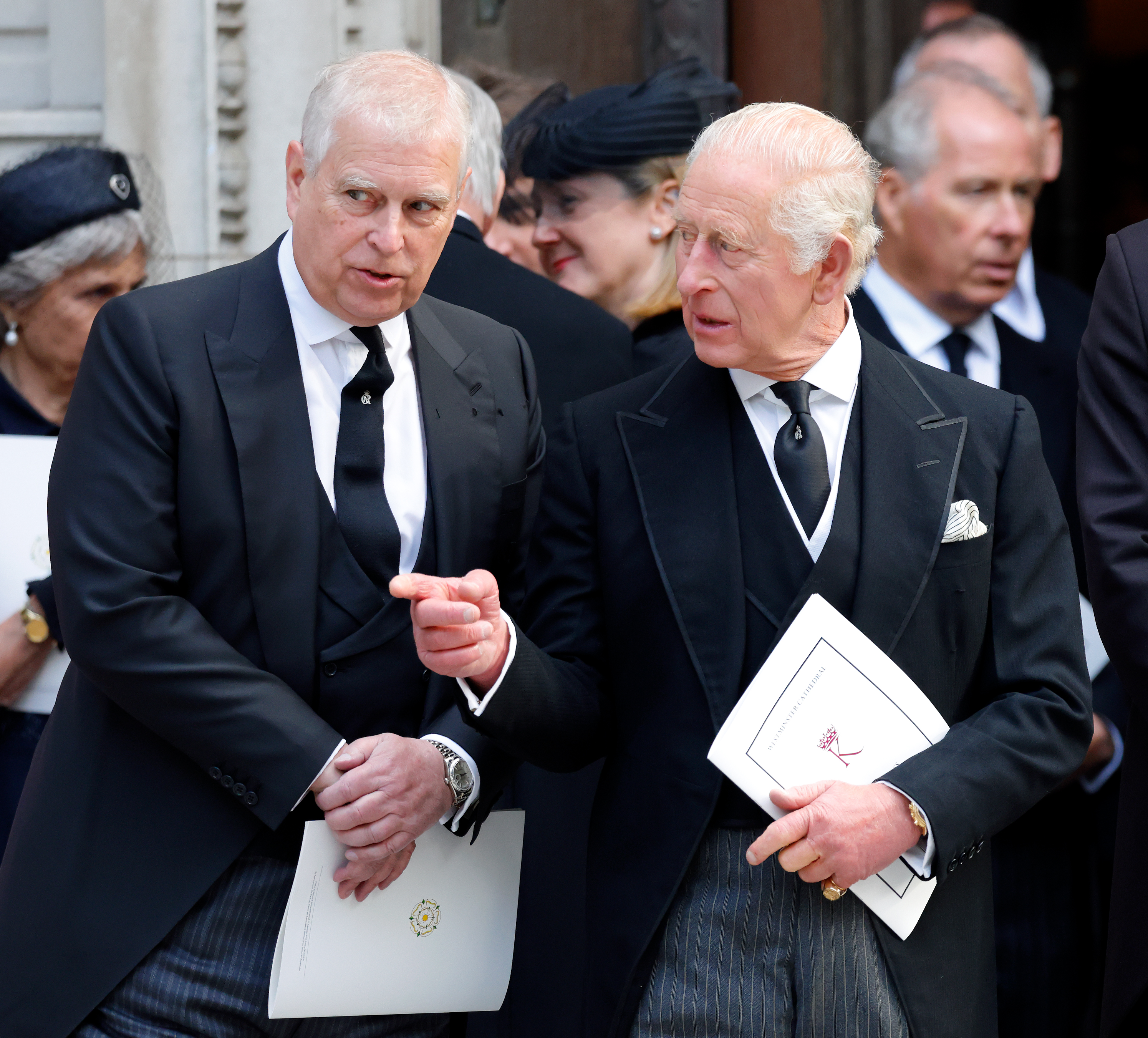 Prince Andrew and King Charles wearing black suits at the Duchess of Kent's funeral