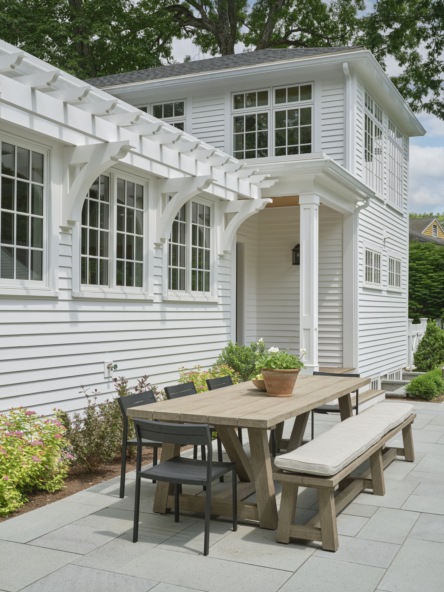outdoor dining area with small pergola