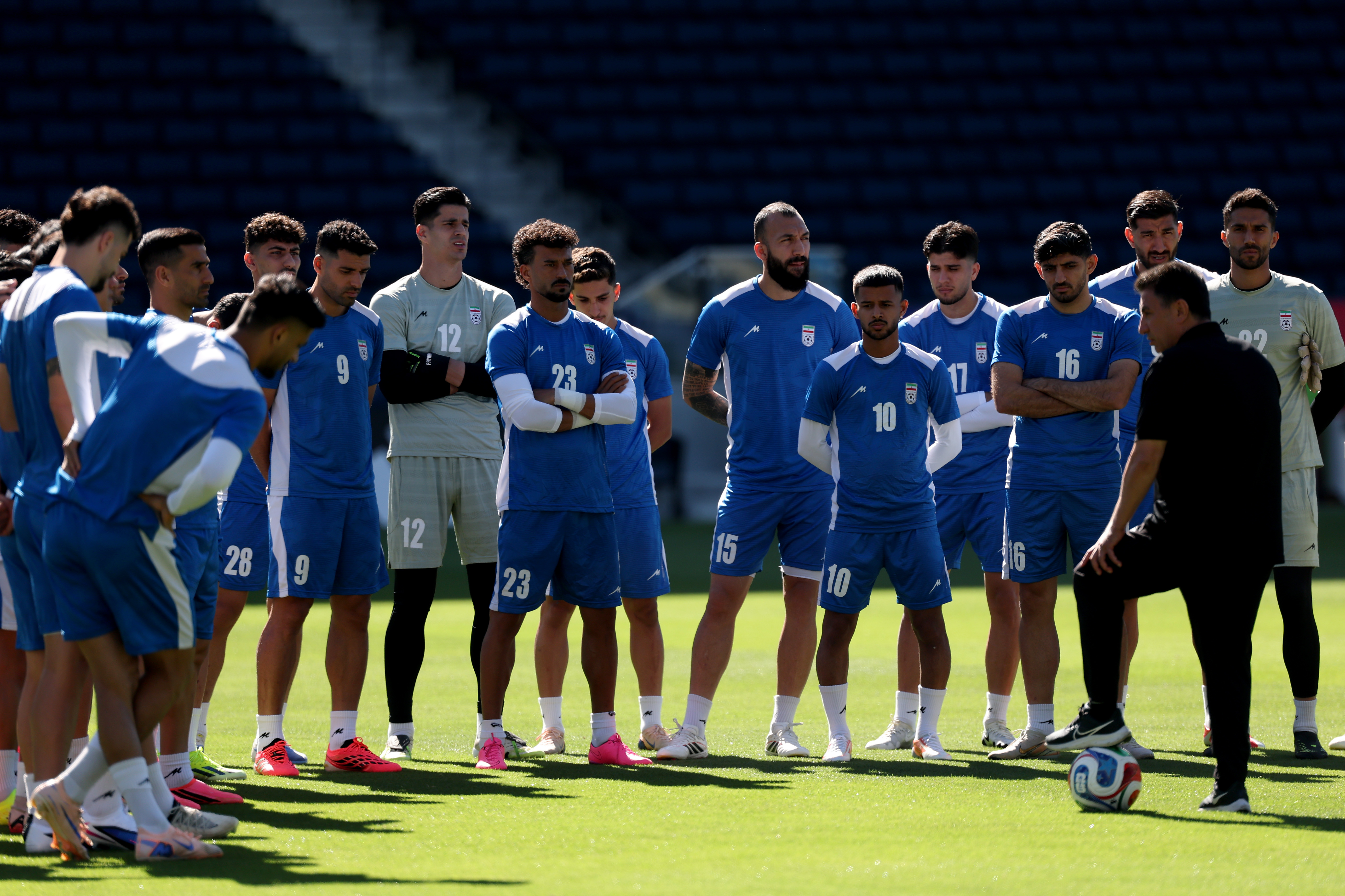 INGLEWOOD, CALIFORNIA - JUNE 20: Amir Ghalehnoy, Head Coach of IR Iran, speaks with his players during the training and press conference of IR Iran one day ahead of the FIFA World Cup 2026 Group G