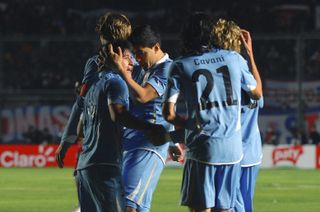 Uruguay players celebrate a goal against Peru at the 2011 Copa America.