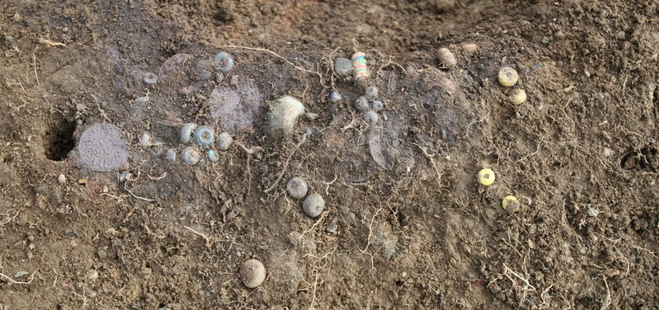 Beads found buried at excavation site.