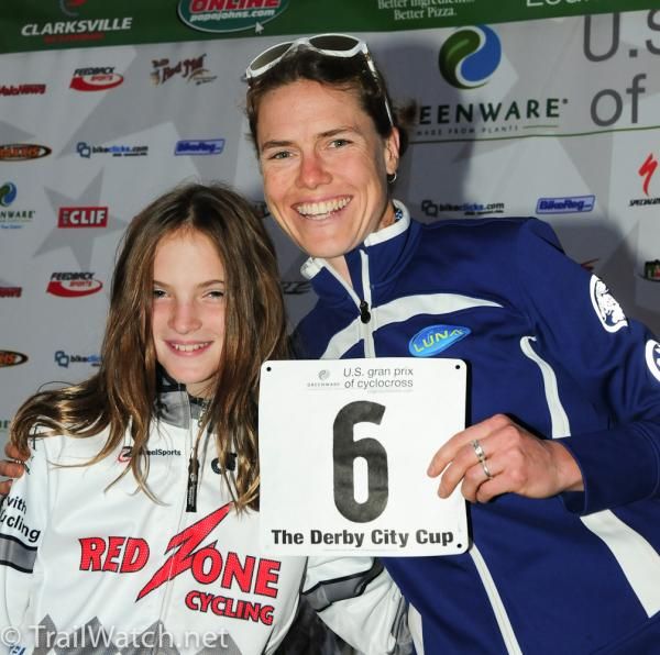 Georgia Gould (Luna Pro Team) is awarded her number by a young member of the Red Zone Cycling team