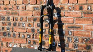 Öhlins RXF34 m.2 leaning against a wall
