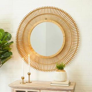 A wicker circular mirror from Wayfair