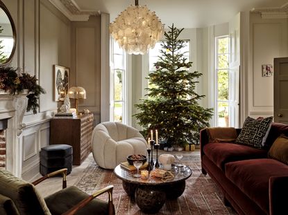 A living room decorated with a Christmas tree