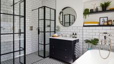 A bathroom makeover, a stylish monochrome traditional style bathroom with modern content, a bathtub, wash stand with storage, mirror and shower unit.