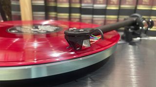 Rega Planar 3 RS Edition turntable close up on tonearm and cartridge