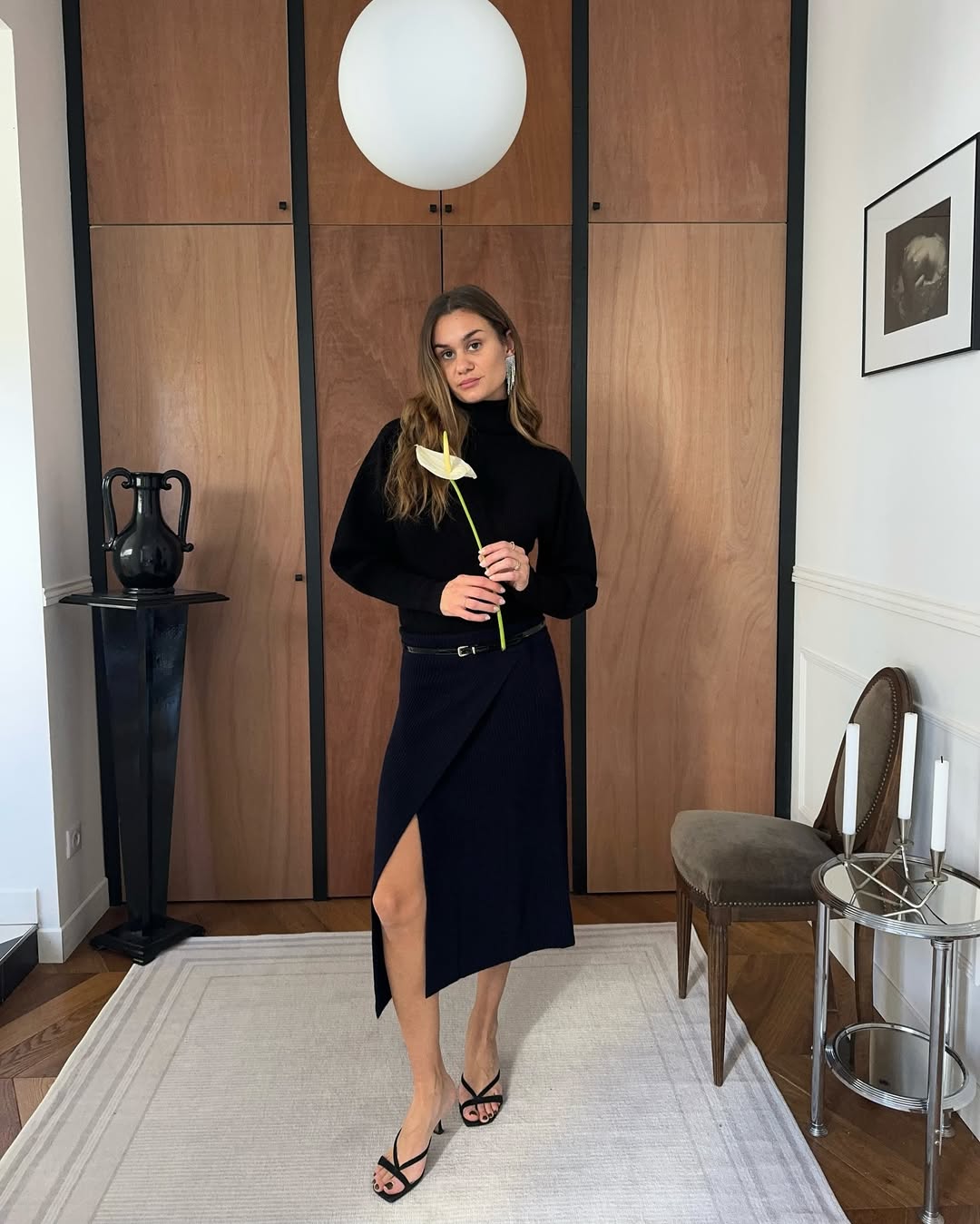 Adenorah in a skirt and sweater