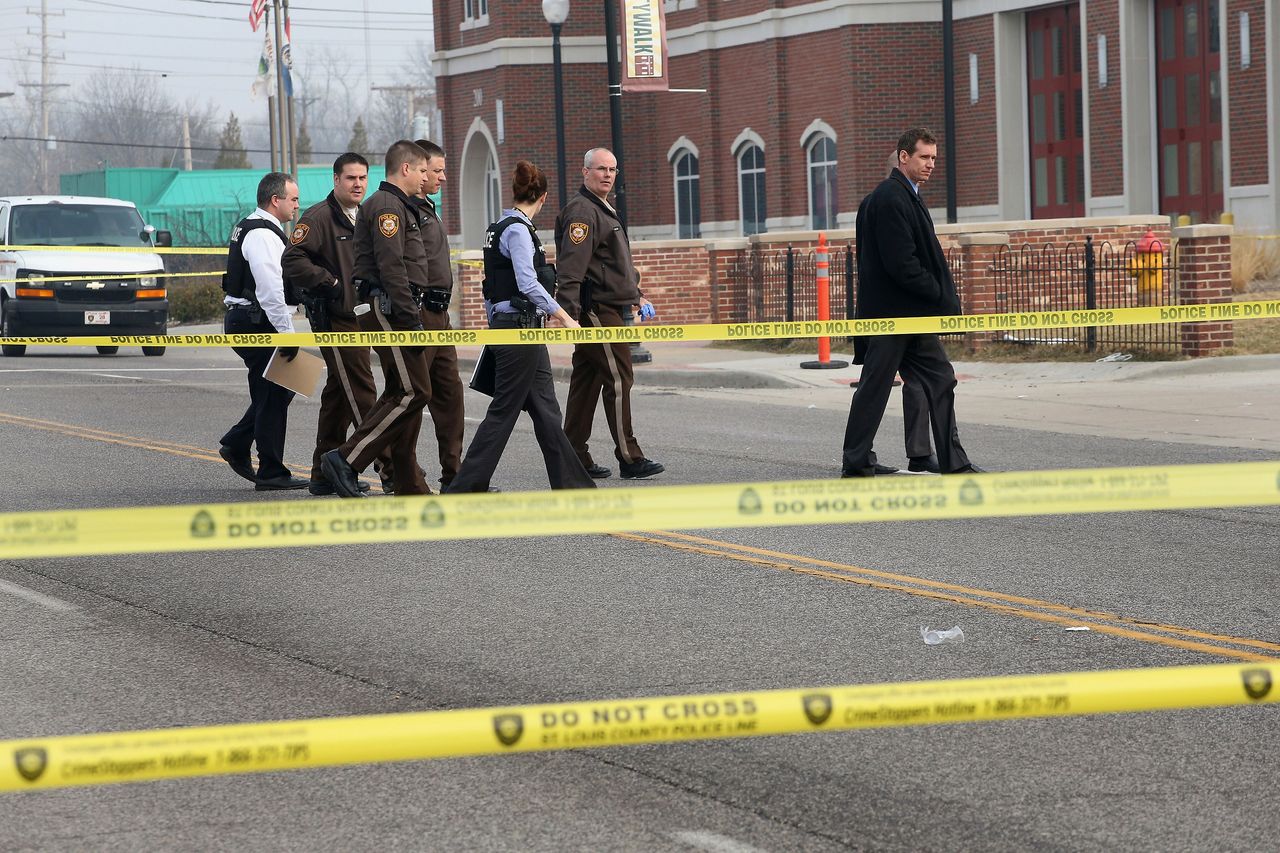 Police look for evidence in Ferguson. 