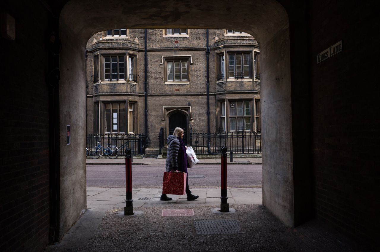A person walking in front of a tunnel shot on the Leica M11