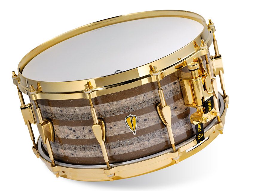The drums are bonded without any heating or manipulating of the Corian and feel solid and weighty.