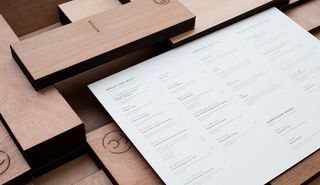Fat Cow's beautiful menus feature its food choices laser etched into wooden planks