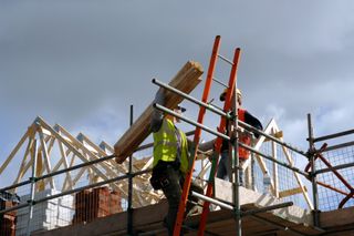 construction workers building a house are covered under a self build insurance policy