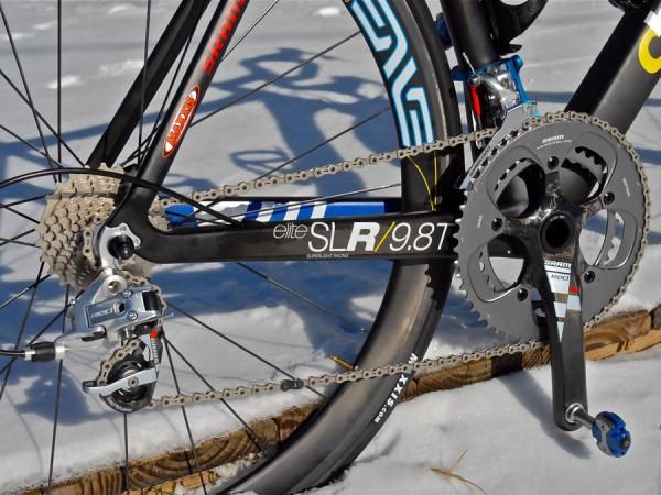 A complete SRAM Red drivetrain is wrapped around the fat chain stays.