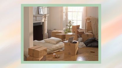 cardboard boxes in an empty apartment with a fireplace
