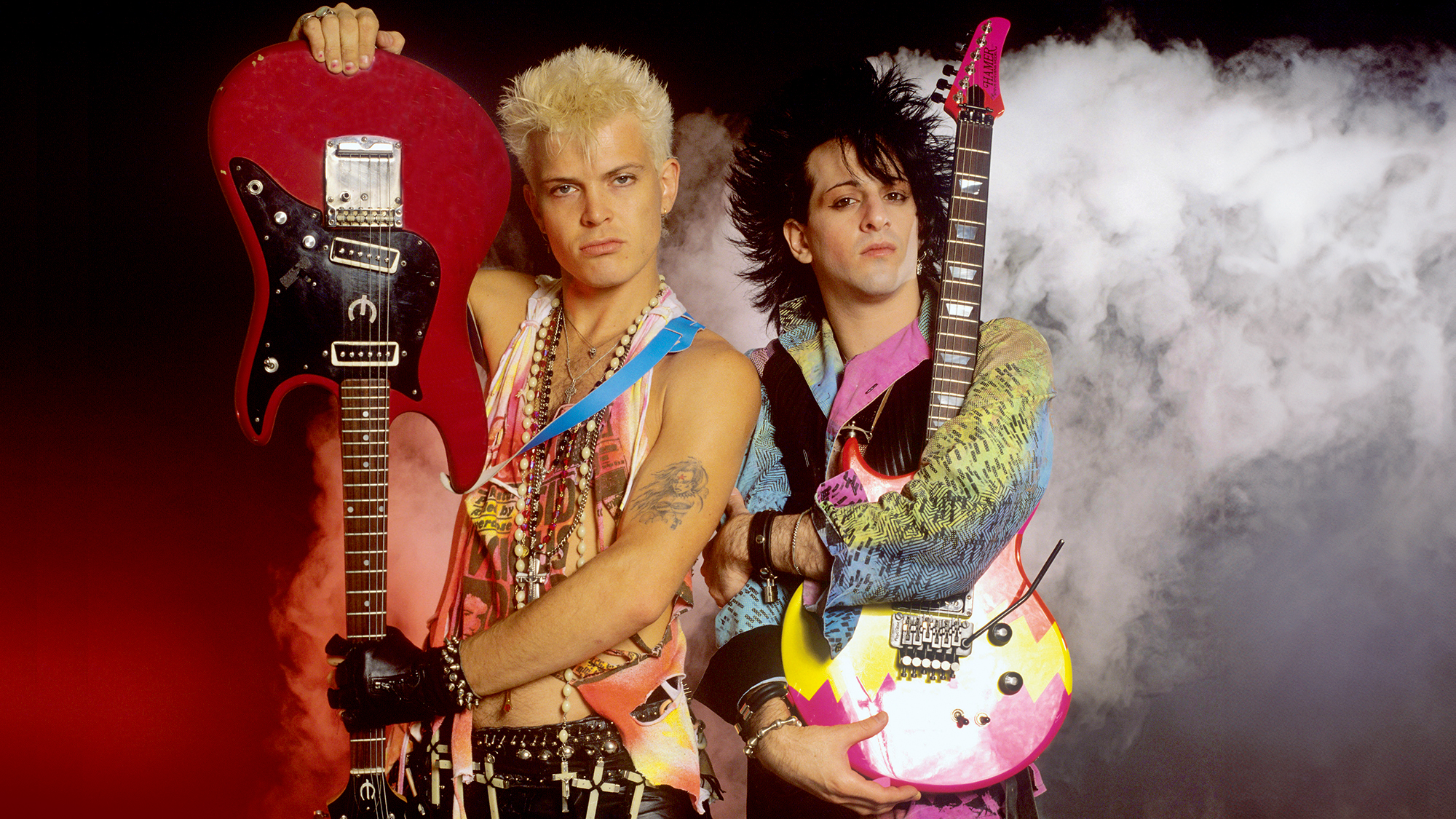 Billy Idol (left) and Steve Stevens hold guitars as they pose in Munich, German, June 25, 1984. 