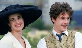 Four Weddings and a Funeral Andie MacDowell and Hugh Grant smiling outdoors