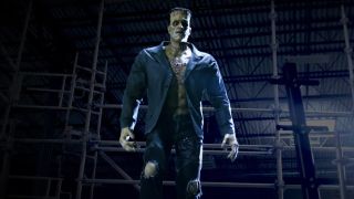 Frankenstein's Monster animatronic stands in a warehouse during a test for Monsters Unchained: The Frankenstein Experiment.