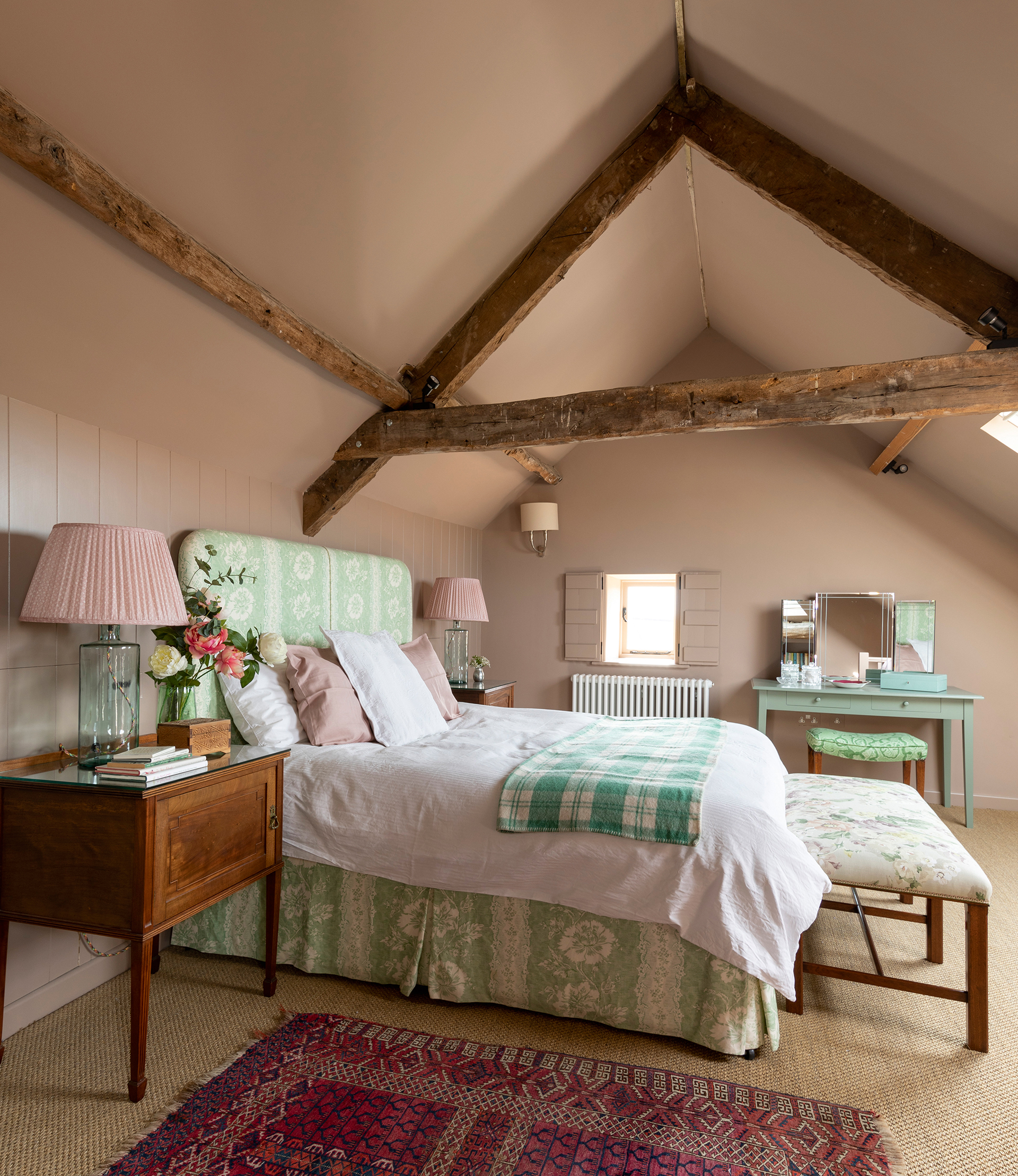 Traditional bedroom ideas - pink and green bedroom in beamed country home