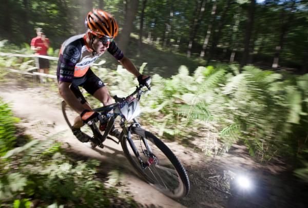 Spencer Paxson (Kona Bicycles) races through Fern Gully.