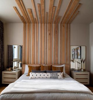 A bed with long headbaord