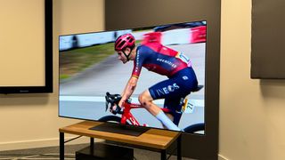 LG G4 (OLED65G46LS) OLED TV slight angle with cyclist on screen