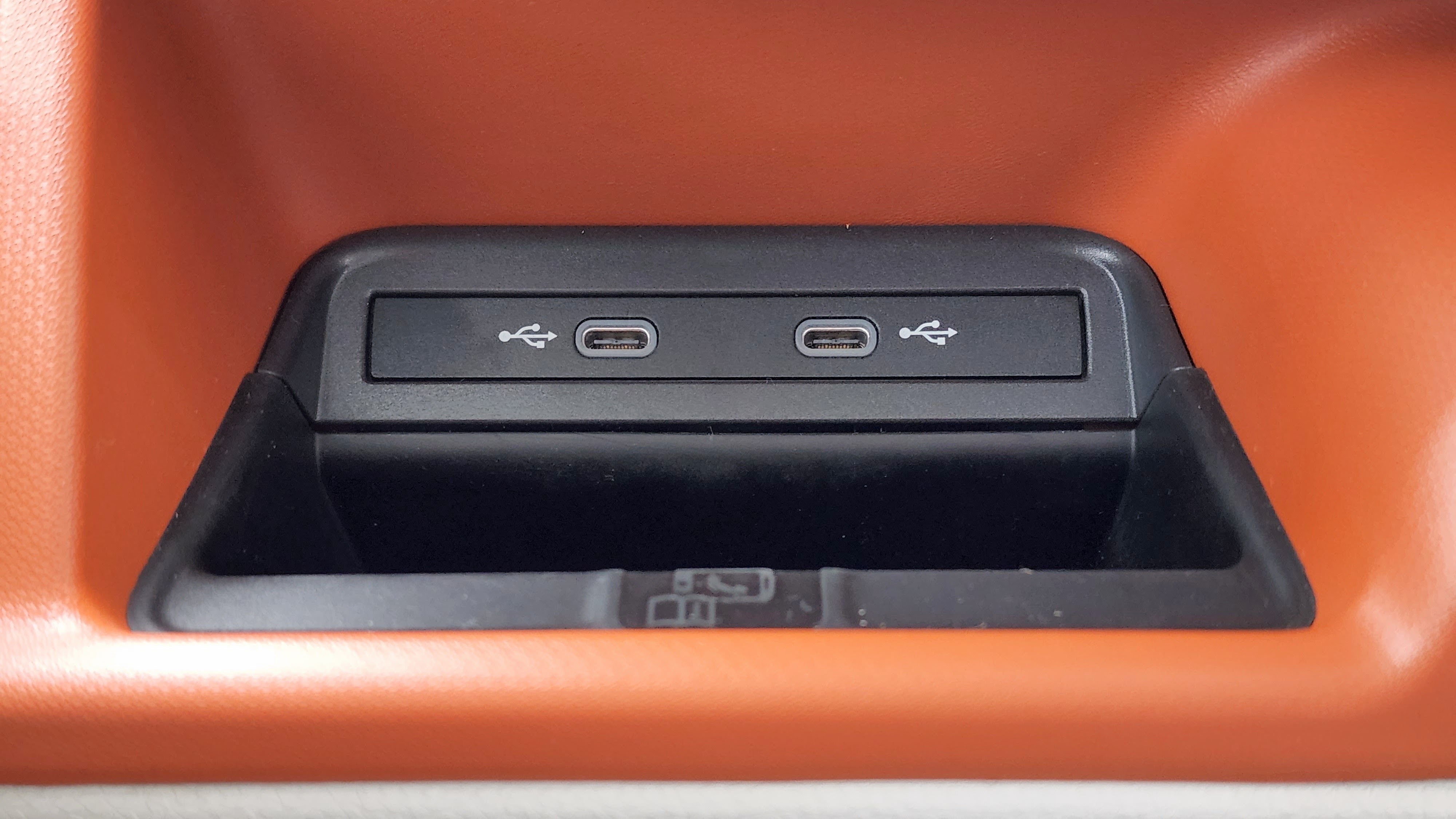 Close-up of two USB-C ports in the front of the VW ID Buzz
