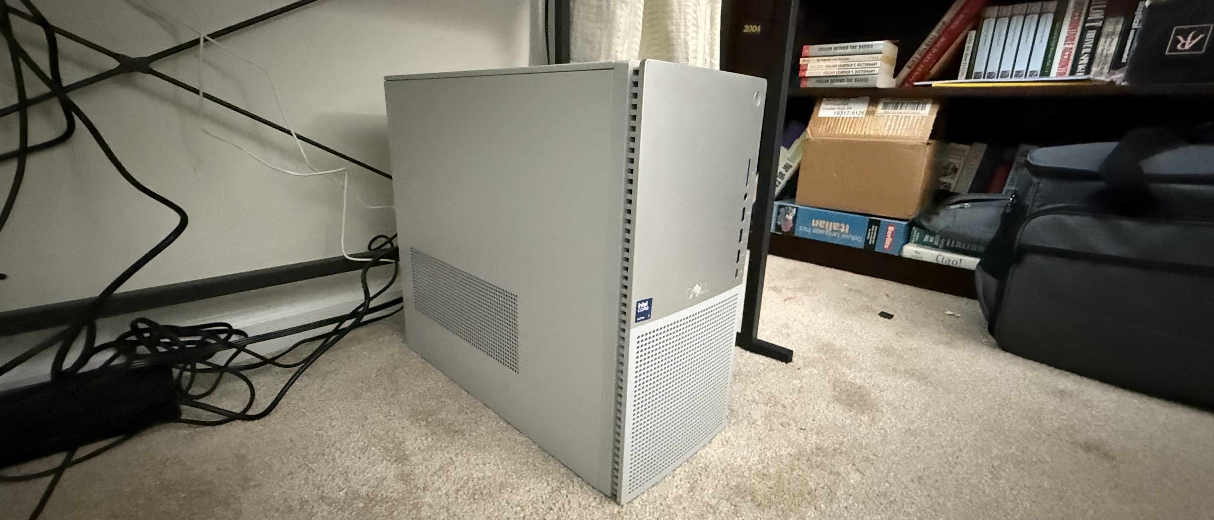 Dell Tower Plus desktop resting on carpet