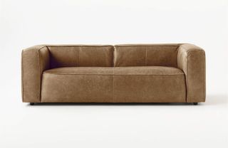 A modern tan low profile leather sofa