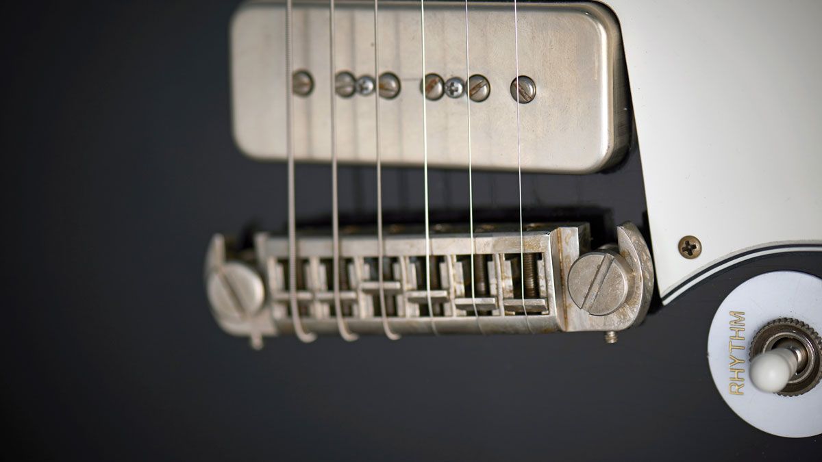 This adjustable wraparound bridge is by TonePros. The hardware is all aged nickel