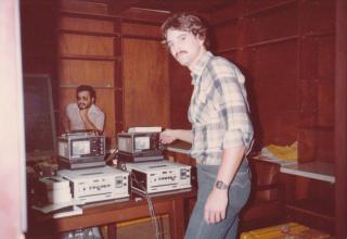 Torelli making clean vertical interval edits using two portable BVU-110 decks of El Salvador revolution material to uplink from Nicaragua, December 1980.