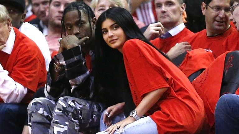 People, Crowd, Audience, Event, Basketball, Footwear, Sitting, Competition event, Coach, Fan,