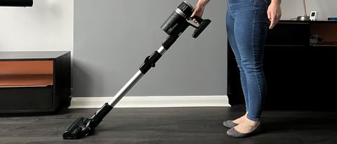 TheHisense Hi-Move IV HVC6264BKUK cordless vacuum being used to clean a hard floor