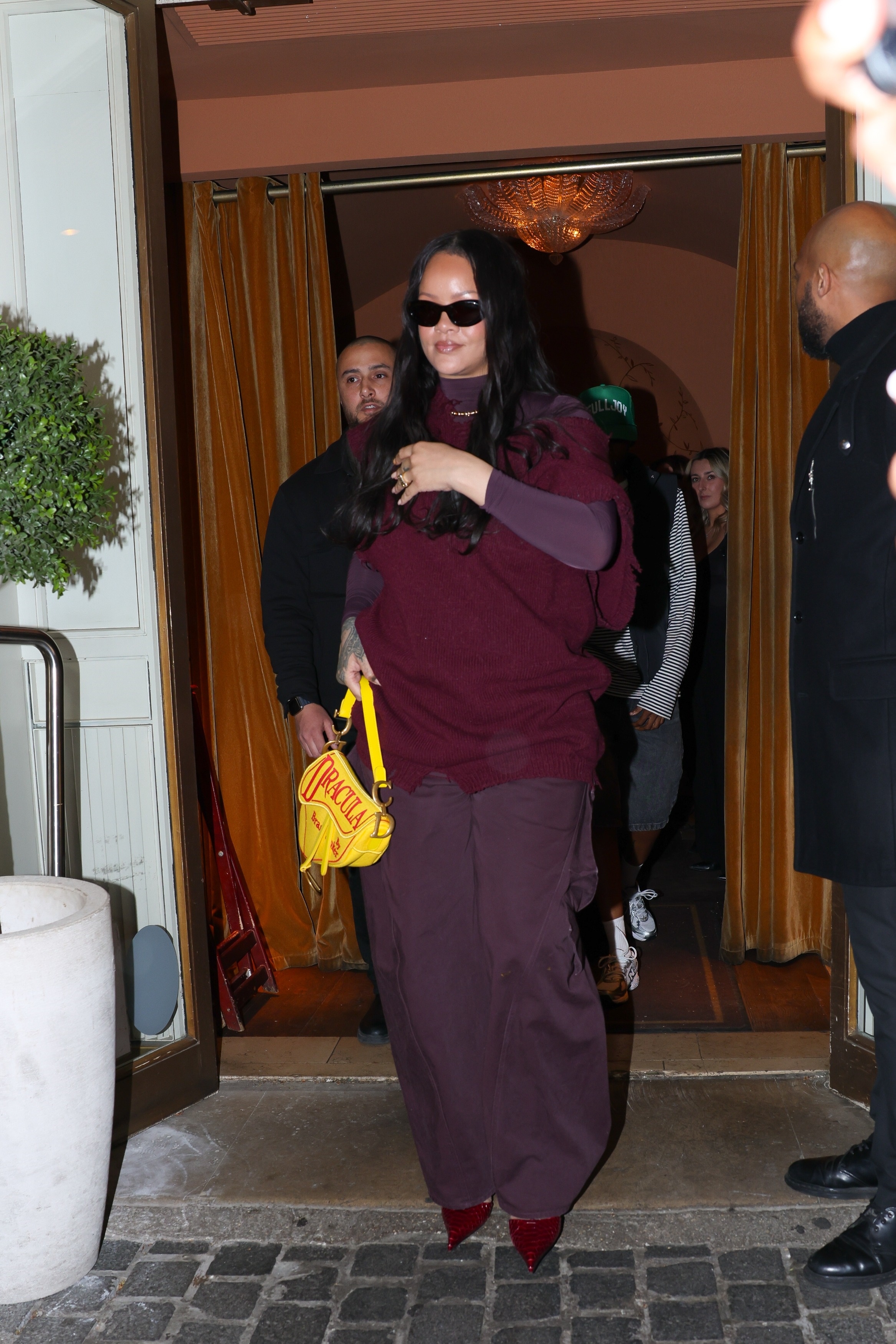 Rihanna&nbsp;and A$AP Rocky are spotted leaving Siena restaurant in Paris, France, with Rihanna carrying a sold-out Dior saddle bag featuring a bright yellow Dracula design