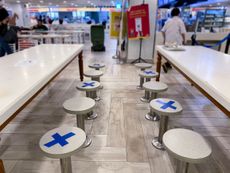 Social distancing rules limit seating in Singapore in March 2020.