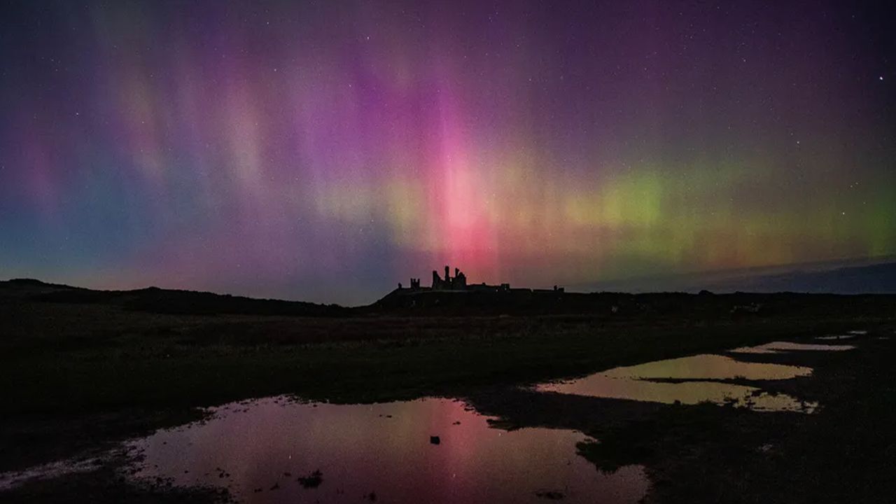 Photograph of mysterious STEVE above Dunstanburgh Castle Northumberland, UK.