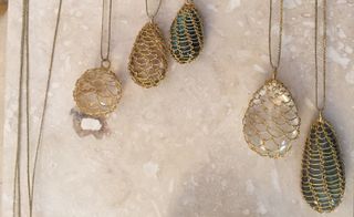 Labradorite, rutilated quartz and crystal quartz pendants wrapped in 18 carat gold wire and hung on gold cord