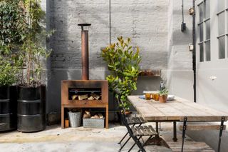 courtyard garden with seating and wood fired BBQ