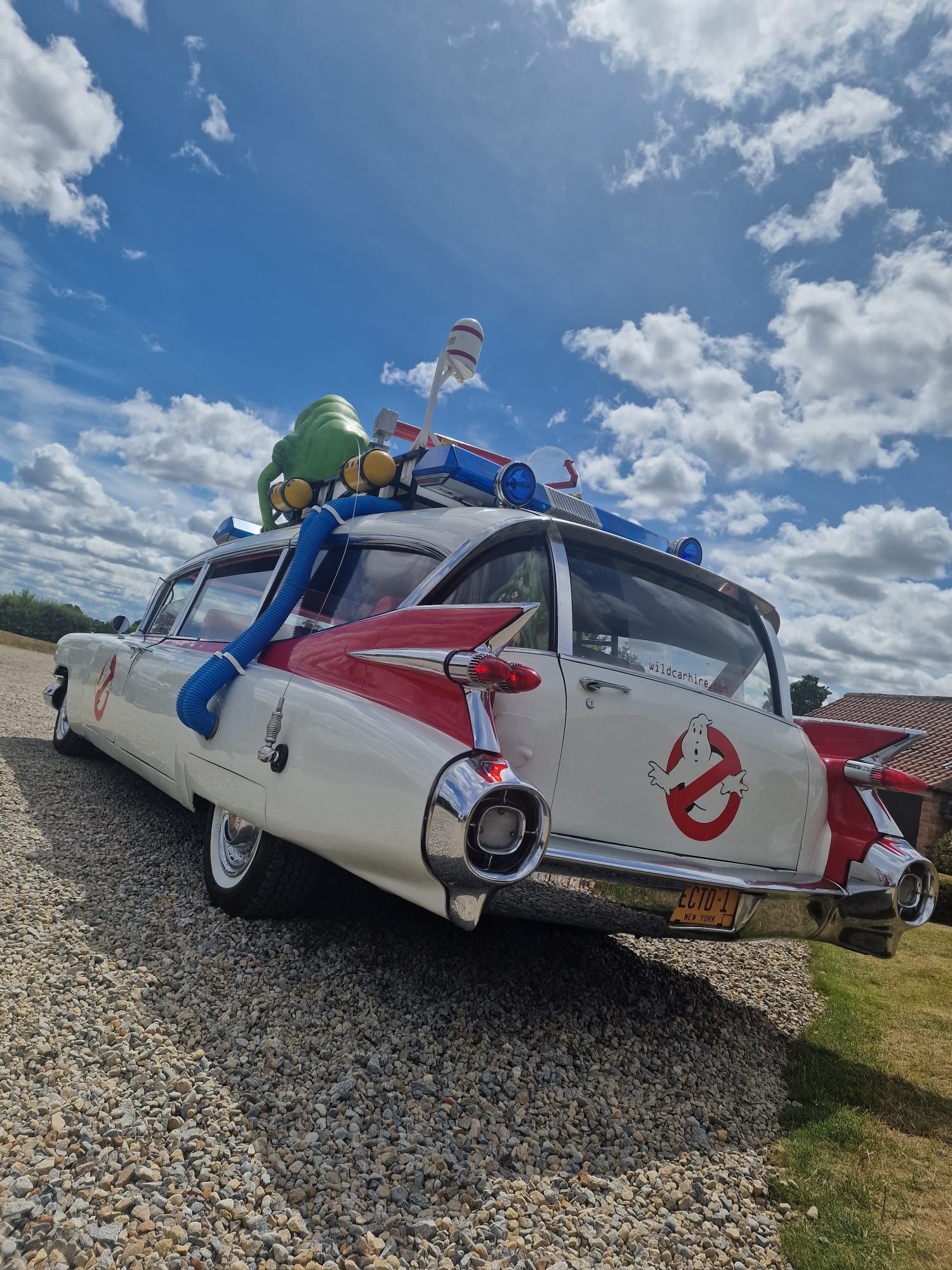 Images of the Ghostbusters car. It looks like the Ghostbusters car, but also it's parked outside of your parents house for some reason