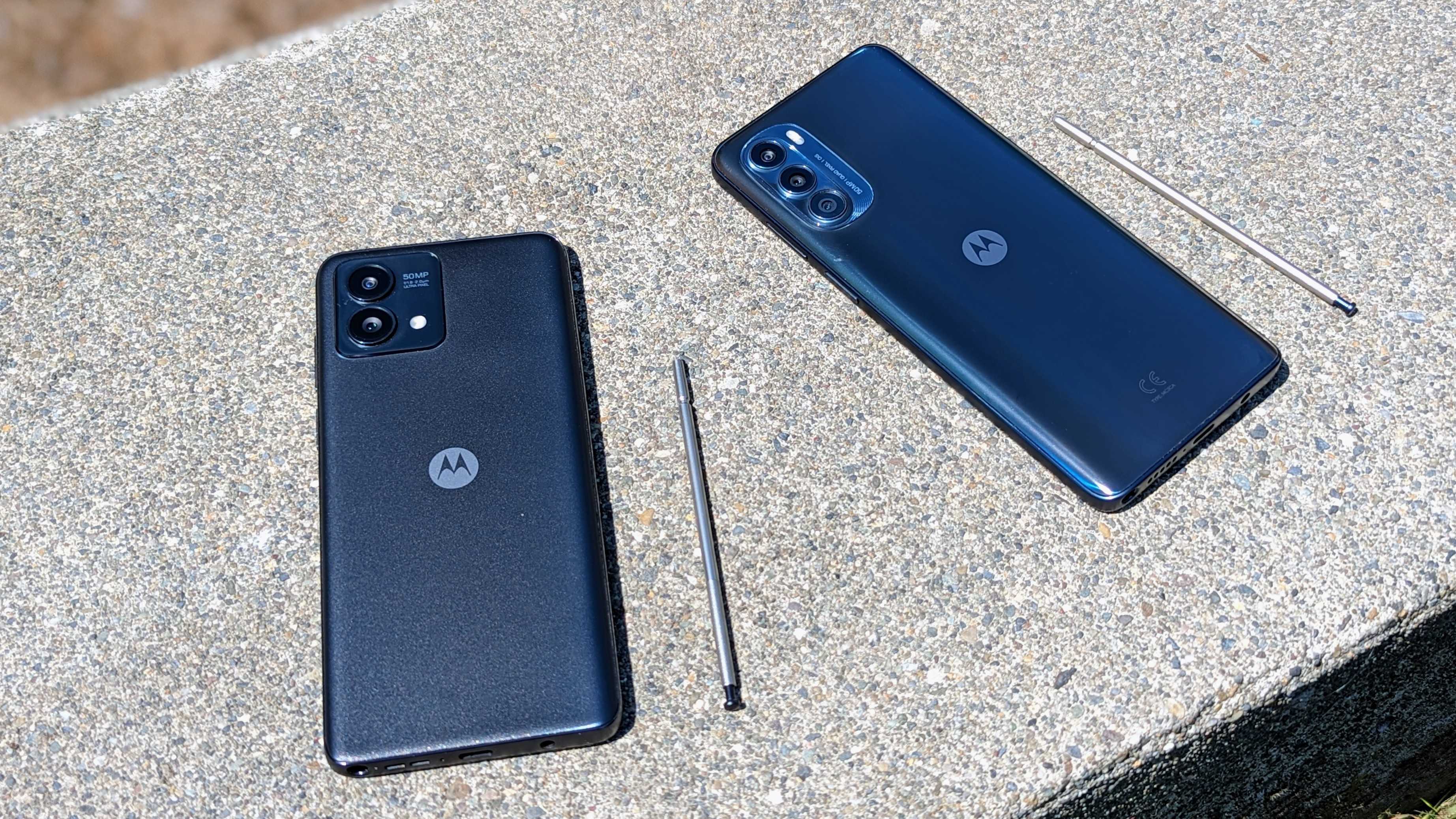 The Moto G Stylus 5G (2023) and (2022) side by side with stylus pens out