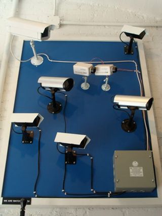 Collection of vintage security cameras at Partners & Spade