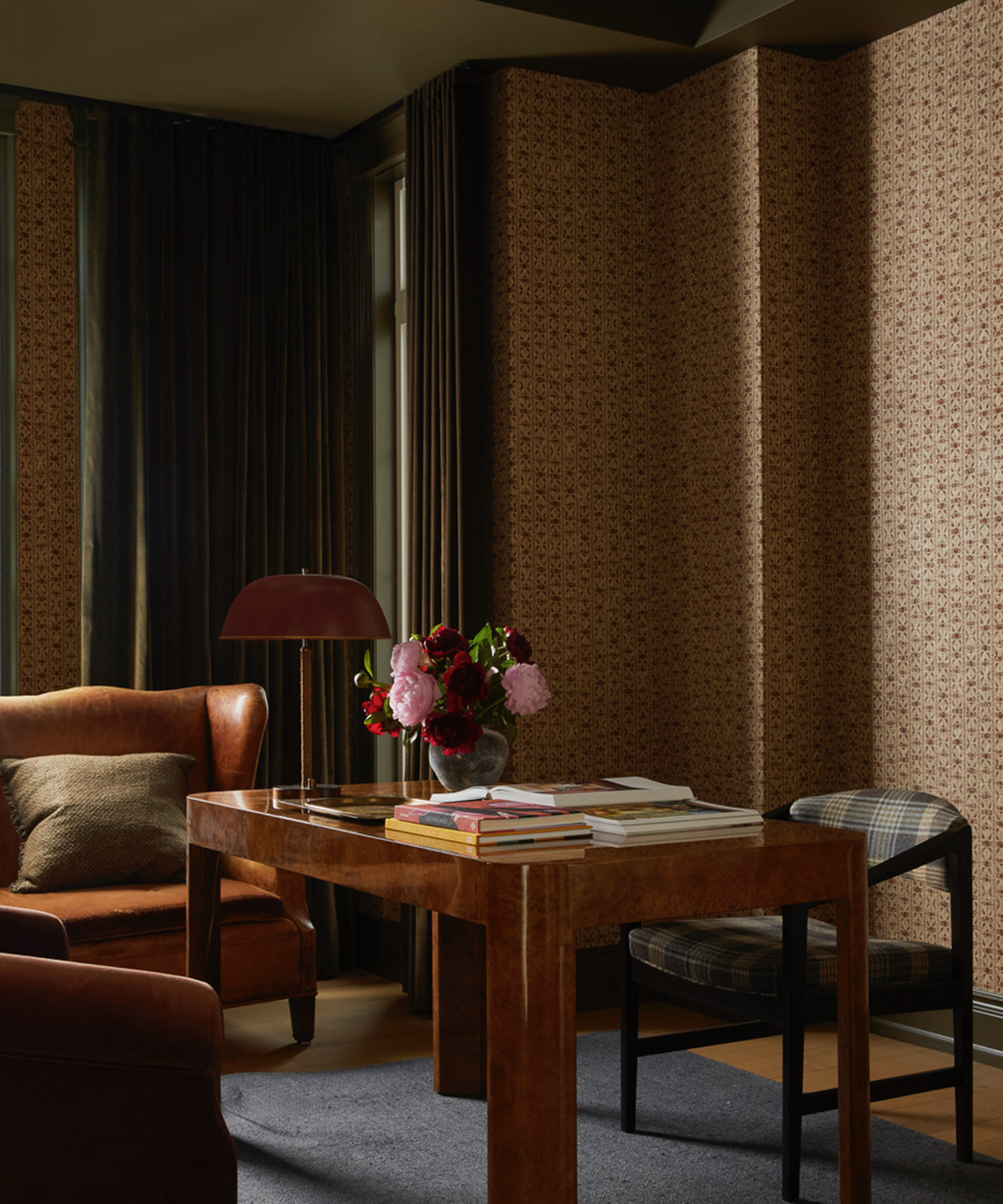 home office with wallpaper and brown ceiling