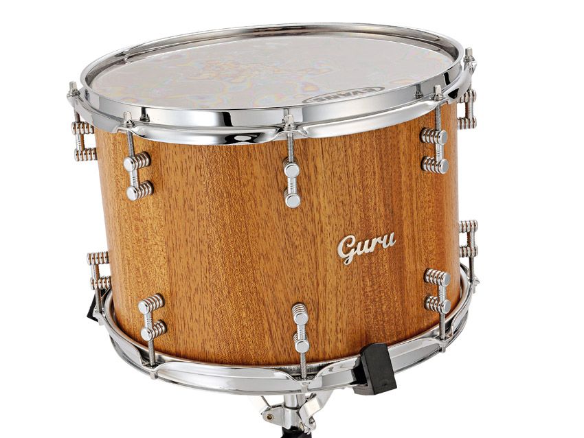 These gorgeous toms and bass drum are crafted from solid staves of reclaimed 100-year-old mahogany.