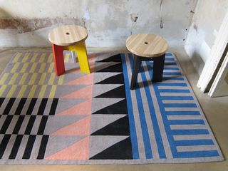 Wooden stools on patterned rug
