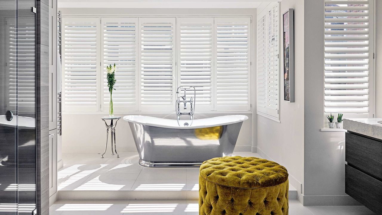 bathroom with window and tub