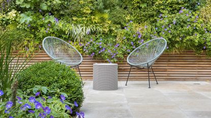 contemporary patio area using limestone patio materials designed by John Davies